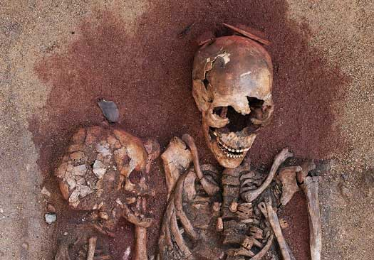 Why is ochre found in some graves?