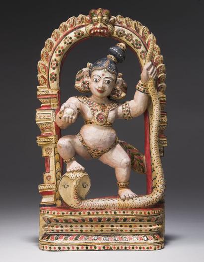 Wooden figure depicting lord Krishna dancing on the snake Kaliya collected by K.E. Mourier, 1830s. Photo: Arnold Mikkelsen, 2005. National Museum of Denmark (Inv.no. Da.127)