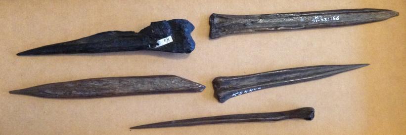 These bone awls were used to make holes in the skins before they were sewn together.